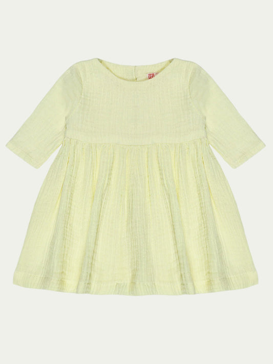 Front view of yellow organic cotton baby dress with long sleeves and pleated design – eco-friendly and breathable, designed for babies aged 0-3 years by Ray&Baby.