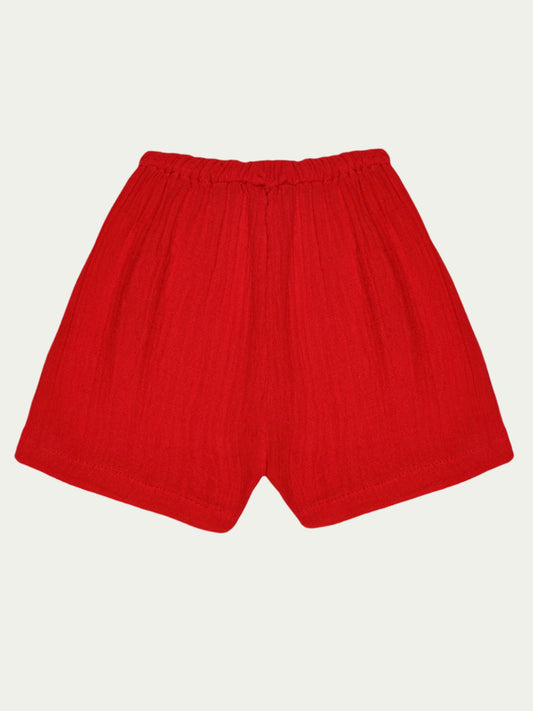 Front view of red organic cotton baby shorts with elastic waistband – eco-friendly and breathable, designed for babies aged 0-3 years by Ray&Baby.