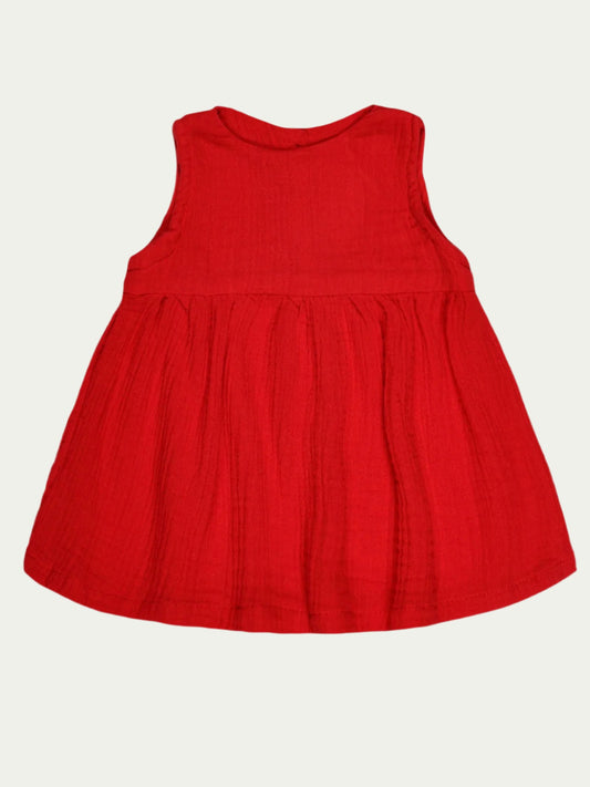 Red sleeveless organic cotton baby dress by Ray&Baby for babies aged 0-3 years, made from eco-friendly GOTS-certified fabric.