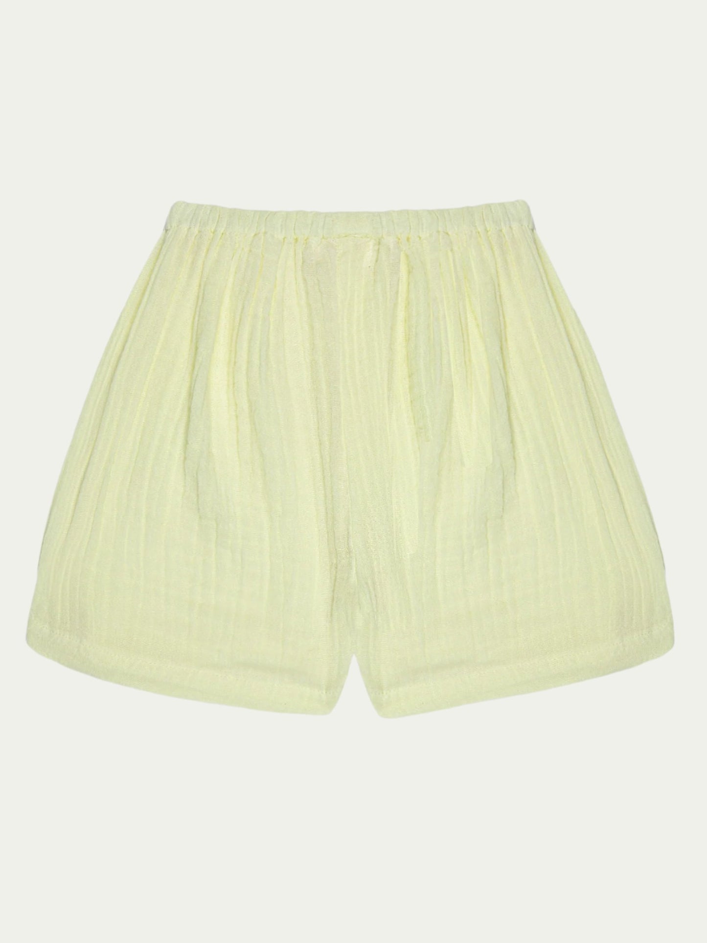 Back view of yellow organic cotton baby shorts with elastic waistband – soft, breathable, and eco-friendly, perfect for babies aged 0-3 years by Ray&Baby.