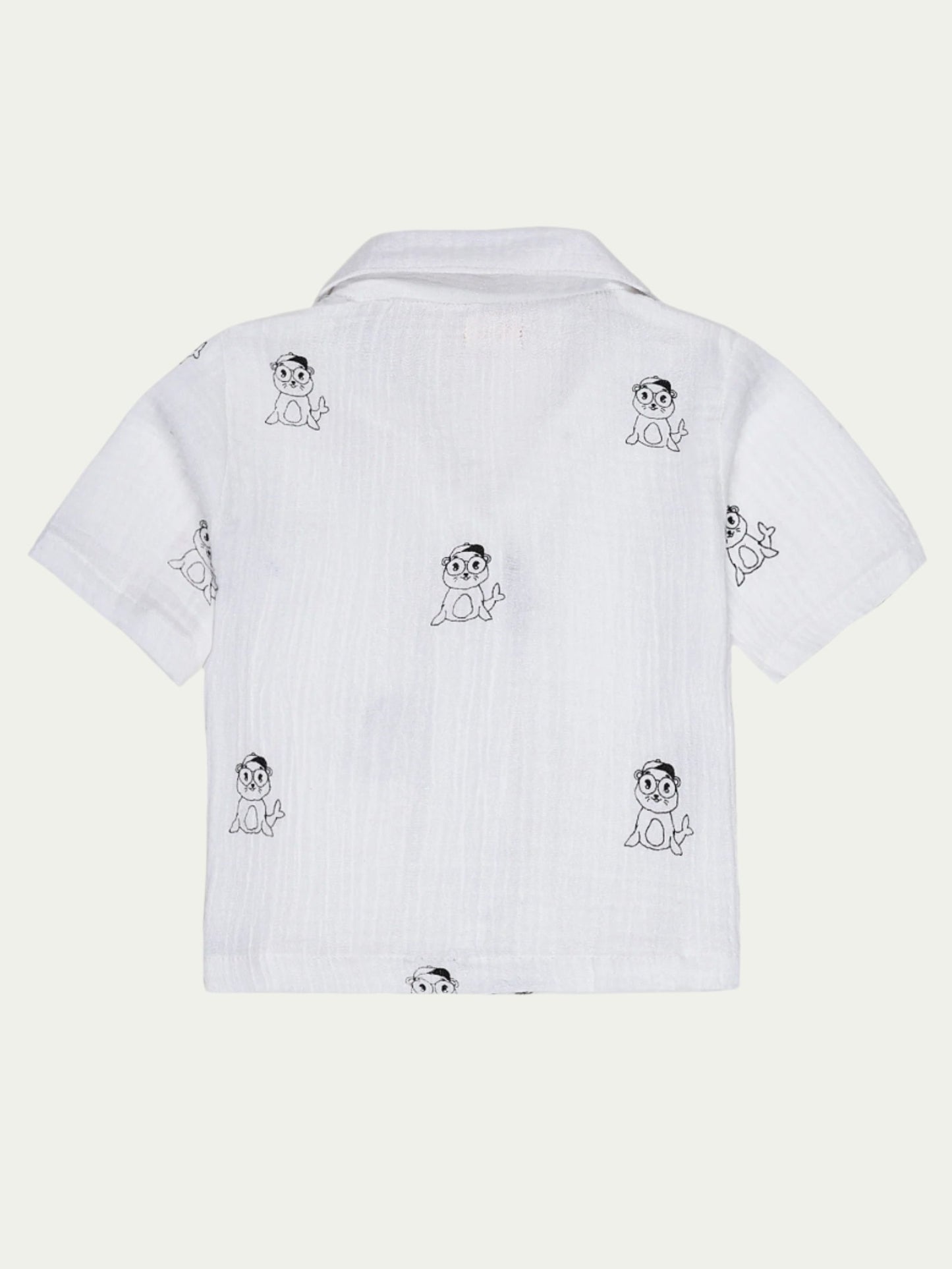 Back view of white organic cotton baby shirt featuring a playful cartoon print and short sleeves – eco-friendly and breathable, perfect for babies aged 0-3 years by Ray&Baby.