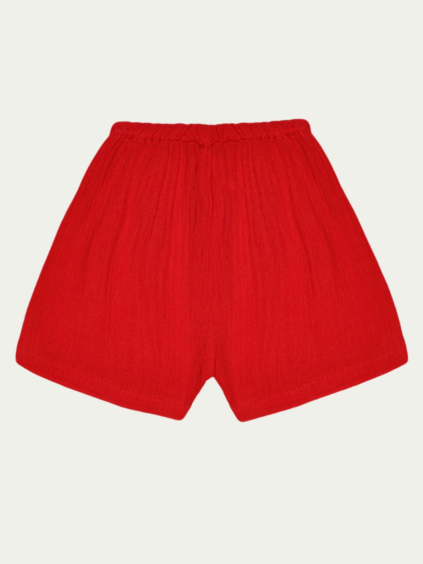 Back view of red organic cotton baby shorts with elastic waistband – soft, breathable, and eco-friendly, designed for babies aged 0-3 years by Ray&Baby.