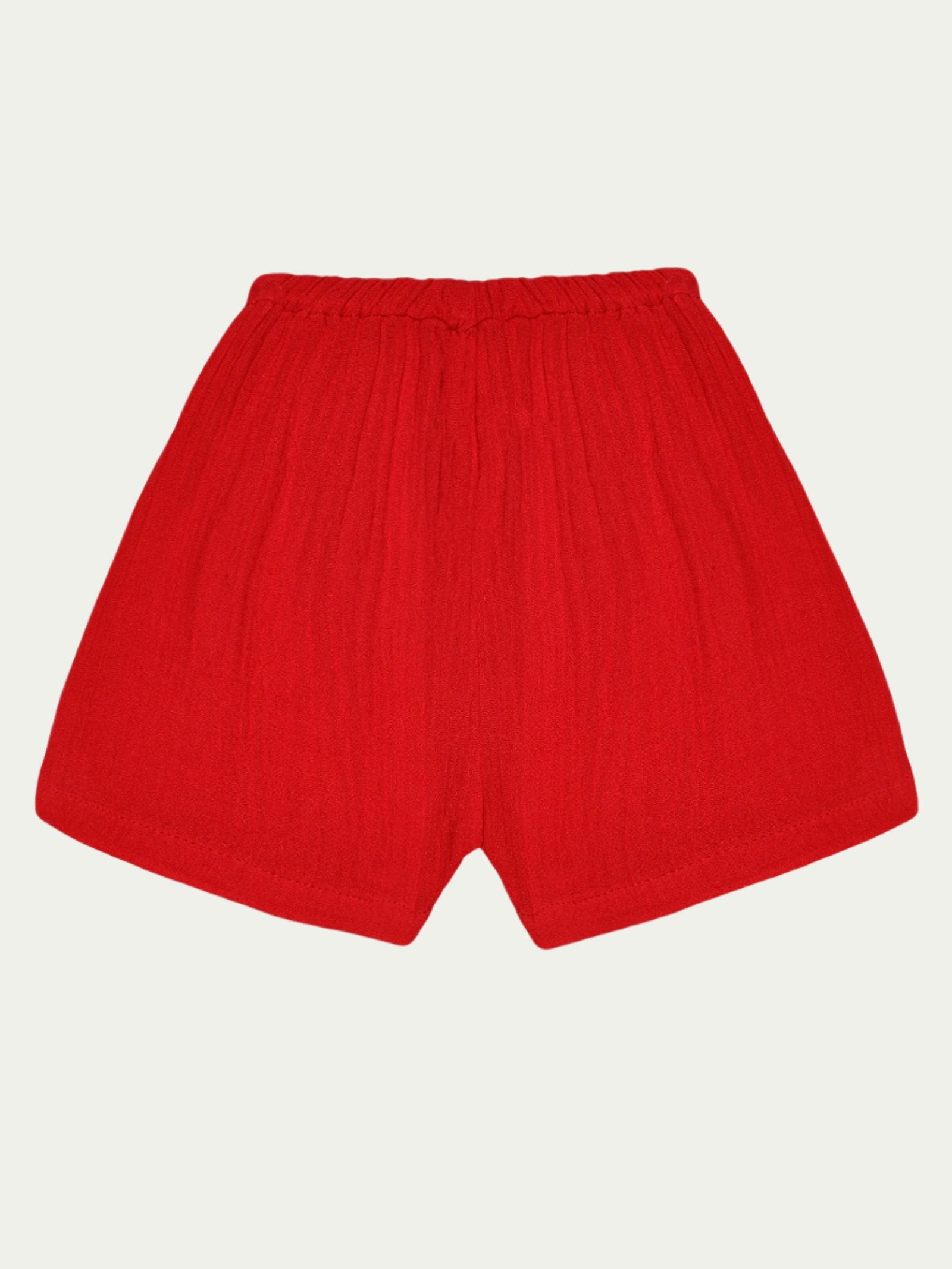 Back view of red organic cotton baby shorts with elastic waistband – soft, breathable, and eco-friendly, designed for babies aged 0-3 years by Ray&Baby.